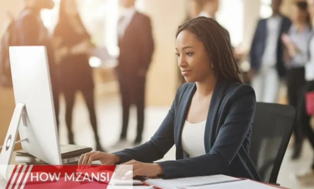 A young professional working in an office, typing on a computer and organizing documents. The setting is a modern educational institution with students and staff in the background. The person looks focused and motivated, wearing smart casual attire in a clean and organized workspace.